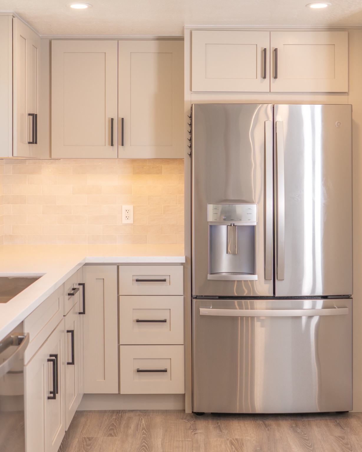 Refrigerator opening with surrounding cabinet storage