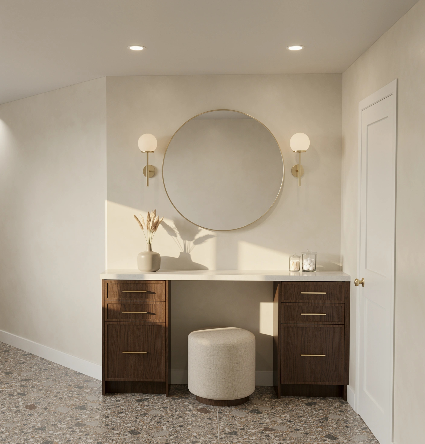 Walnut makeup desk with a pale counter, round mirror and brass hardware